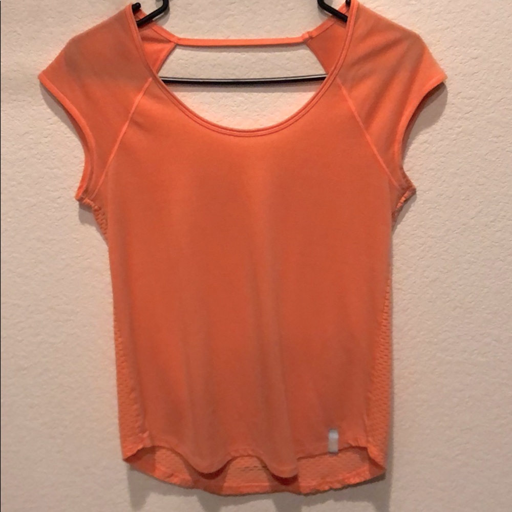 Peach colored Under Armour open back workout top